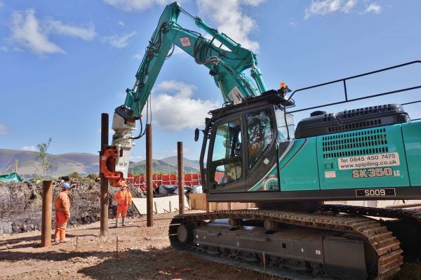 SPI Piling Ltd is installing tubular piles for the construction of a private jetty installation with a Grizzly MG-90 on a Kobelco SK350.